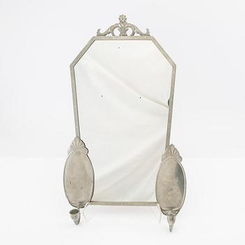 Spegel med lampetter 1900-talets första hälft.