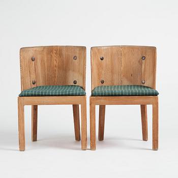 Axel Einar Hjorth, a pair of "Lovö" stained pine chairs, Nordiska Kompaniet, 1930s.