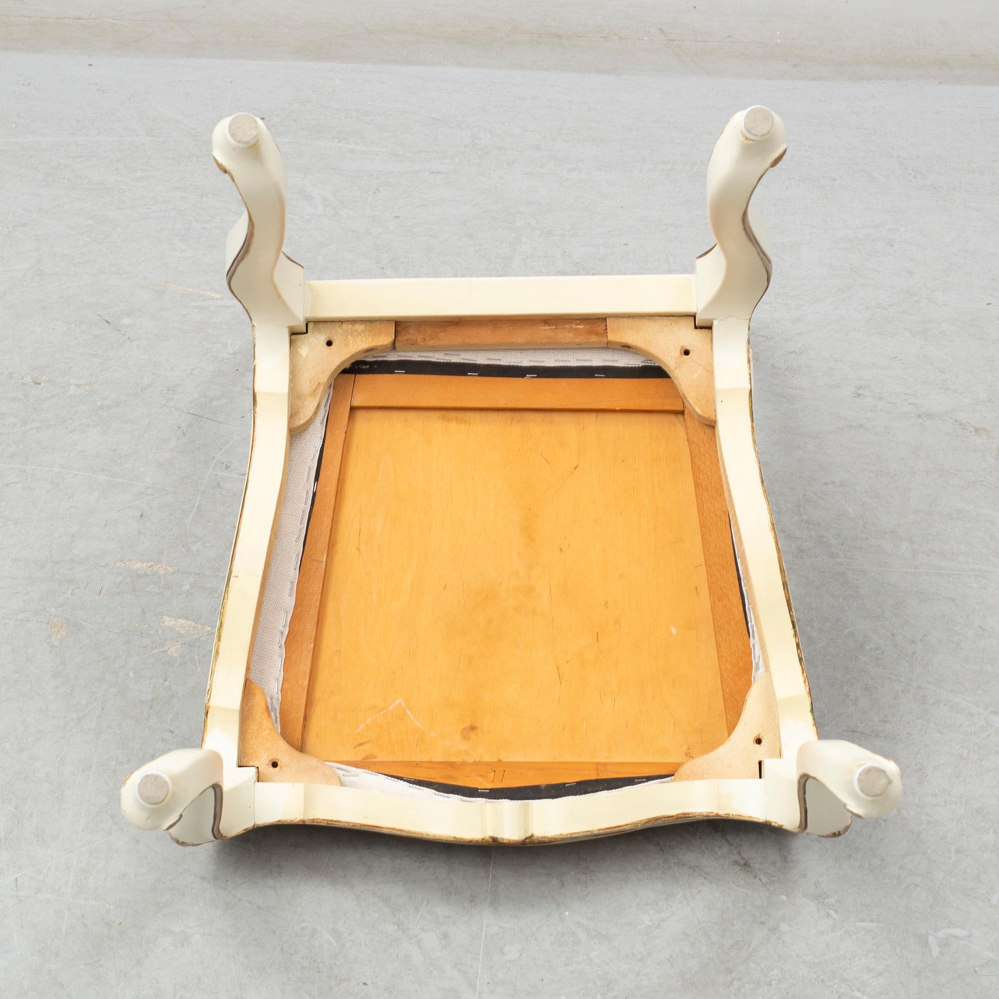 A dining table width twelve chairs, first half of the 20th century.