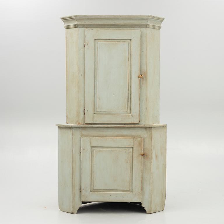 A 19th century corner cabinet.