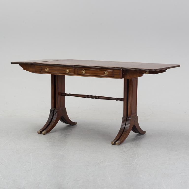 A mahogany dining table with folding and additional leaves, Nordiska Kompaniet, designed 1945.