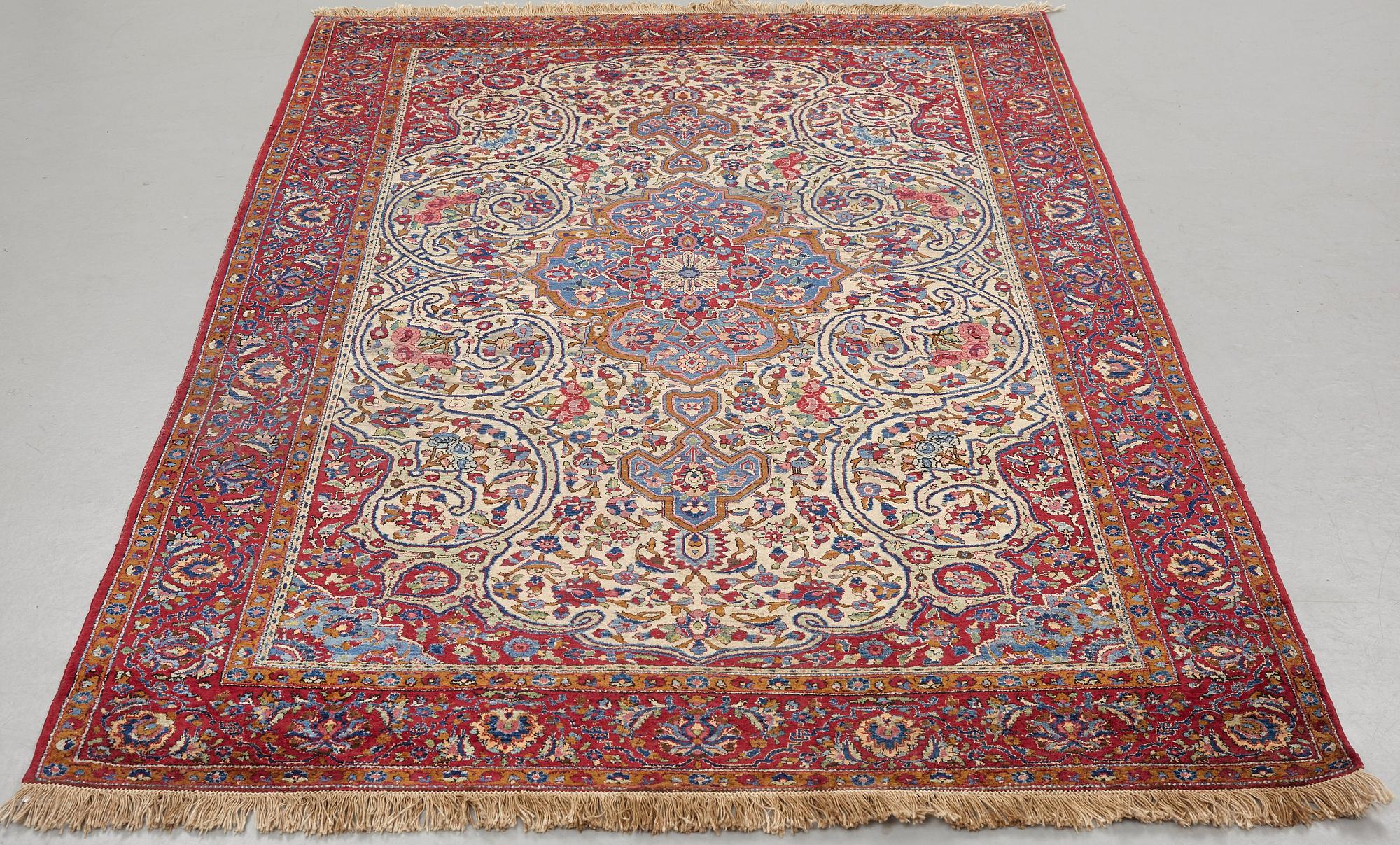 Matto, a semi-antique silk Kashan, ca 212,5-214,5 x 134,5-135,5 cm.