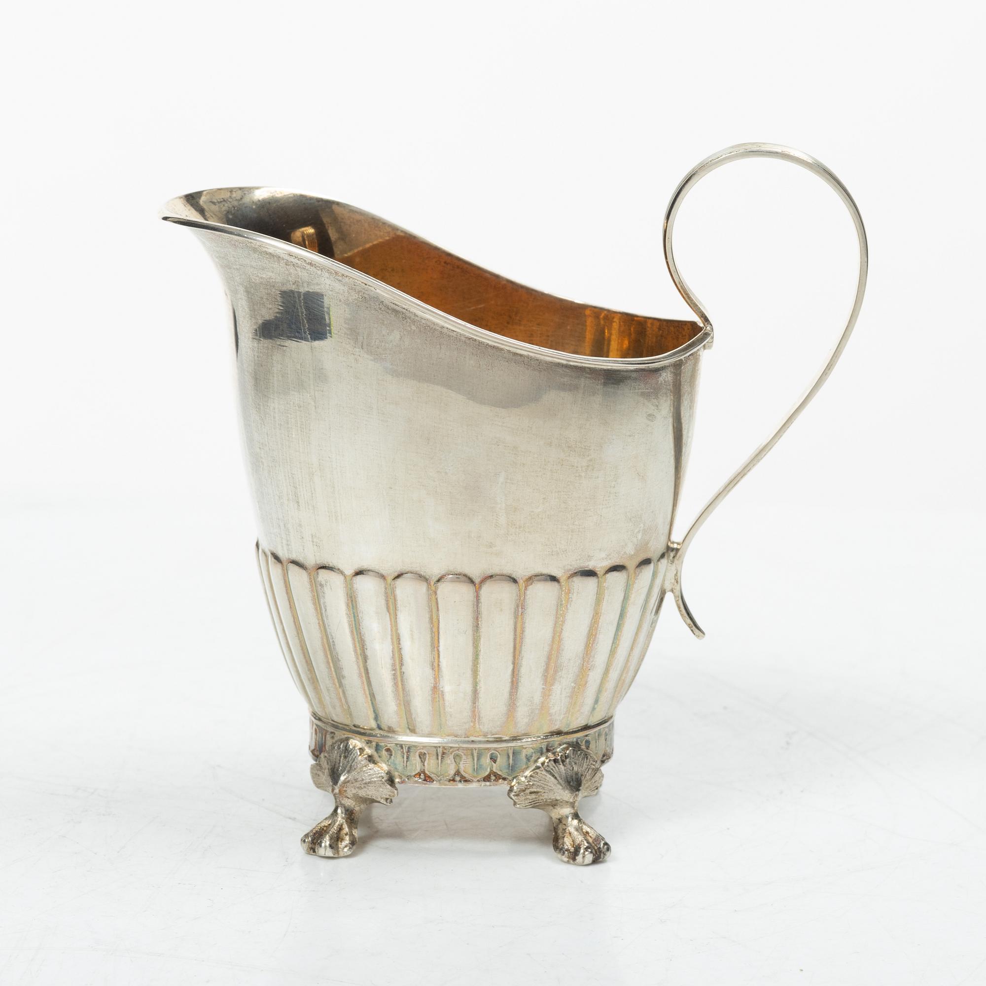 A Swedish silver coffee pot, cream jug and sugar box, Gustavian style, mark of AG Dufva, Stockholm 1911-1912.