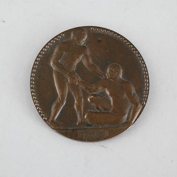 A third plaze bronze medal from the 1924 olympic games in Paris.