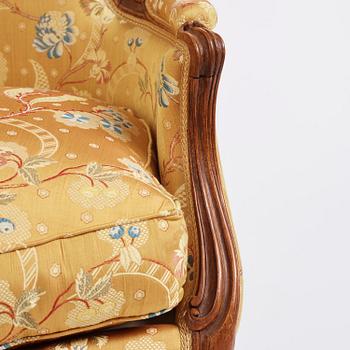 A pair of Louis XV bergeres by Georges Jacob (master in Paris 1765-1814(.