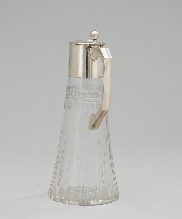 A glass and silver jug, Austria 1901-1921.