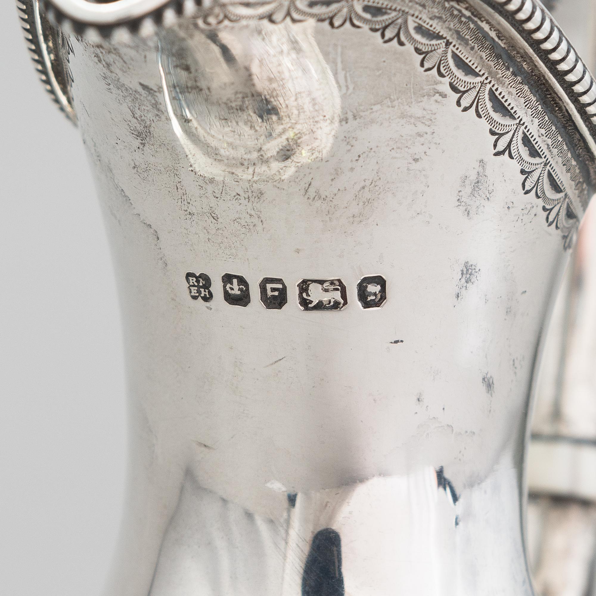 MARTIN, HALL & CO, A sterling silver pitcher, Sheffield 1873.