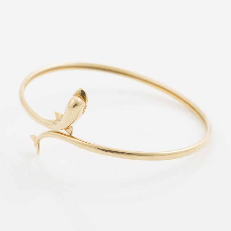 Bracelet/arm ring, 14K gold in the form of a dolphin.
