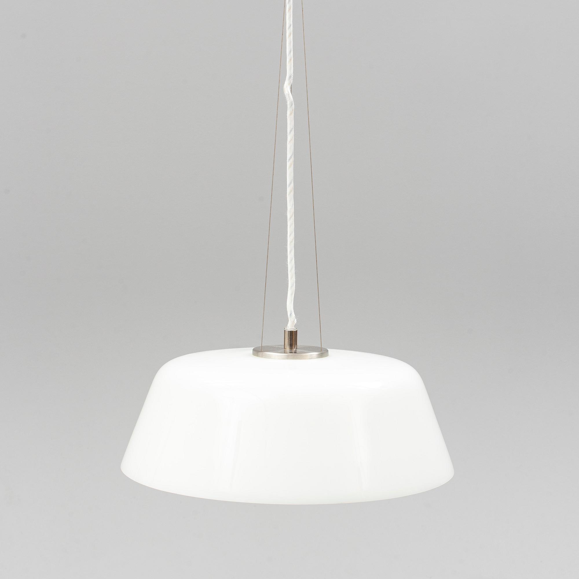 An Arne Jacobsen "Centenary Package" comprising three "Ant Chairs" and an eggshaped table, Fritz Hansen, Denmark.