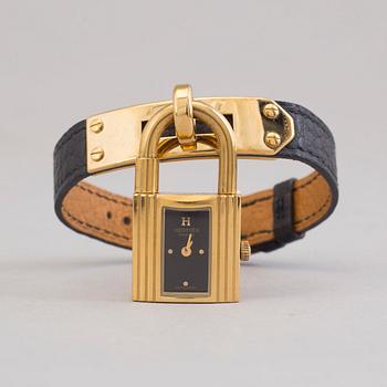 A watch "Kelly Lock" by Hermès.