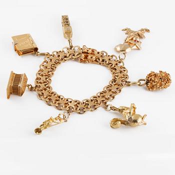 ARMBAND, med 7 berlocker.