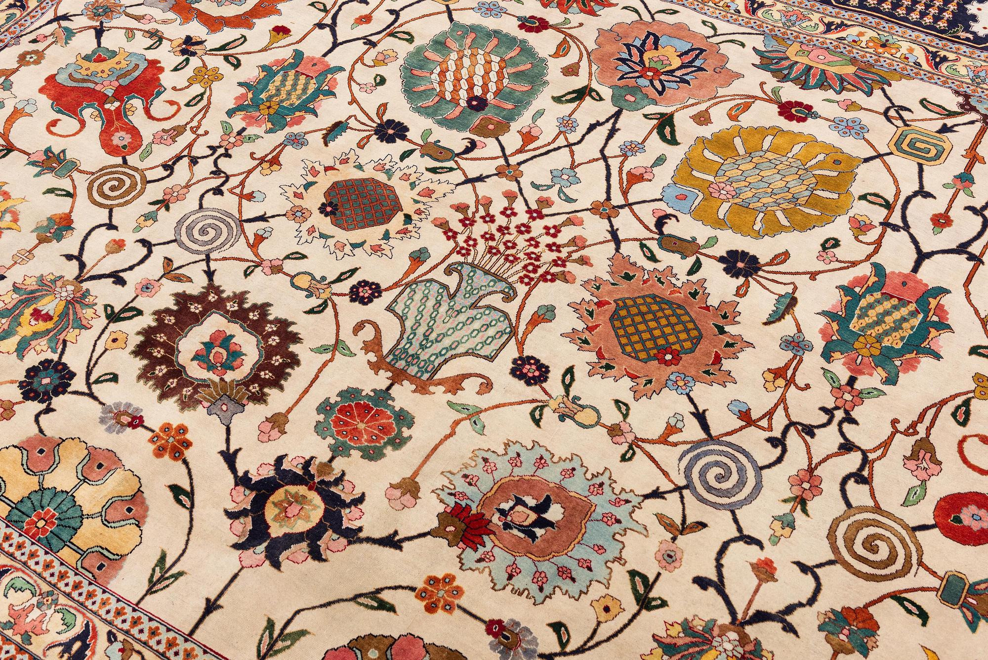 A semi-antique Tabriz carpet, Northwest Persia, of Safavid 'Vase' design, c.328 x 242 cm.
