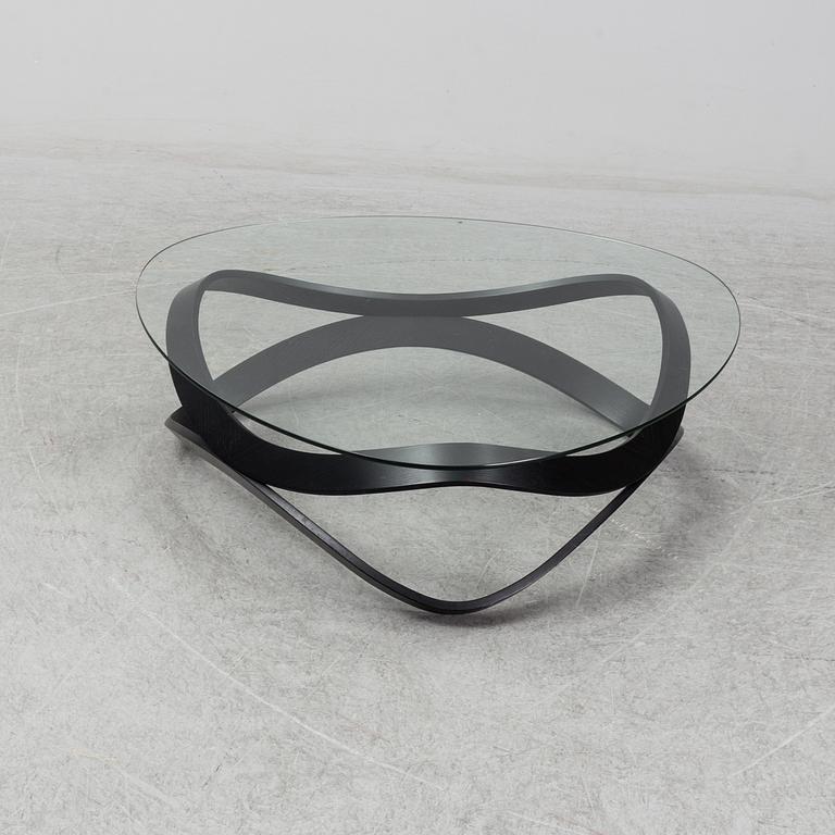 a "Newton" coffee table designed by Dan Sunaga & Staffan Holm in 2009.