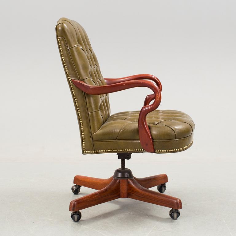 A Chesterfield style sweivel chair, Alex Stuart Design Inc, Chatsworth California USA, late 20th Century.