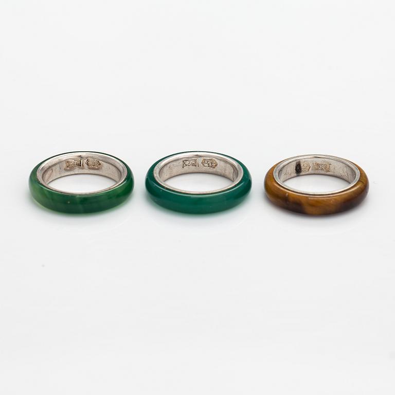 A set of three sterling silver rings, two with chalcedony and one with tiger's eye. Kultakeskus, Hämeenlinna.