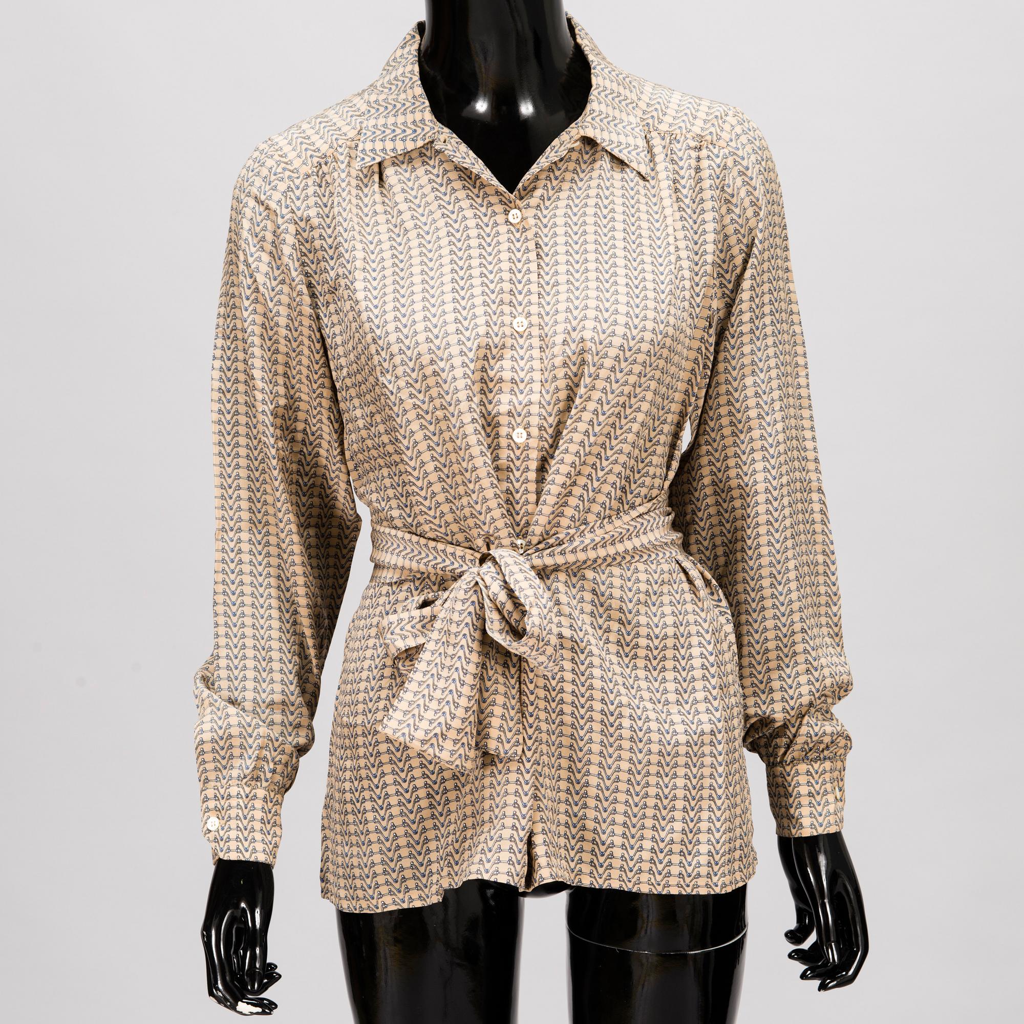 GUCCI Silk Blouse and a Leather Belt.