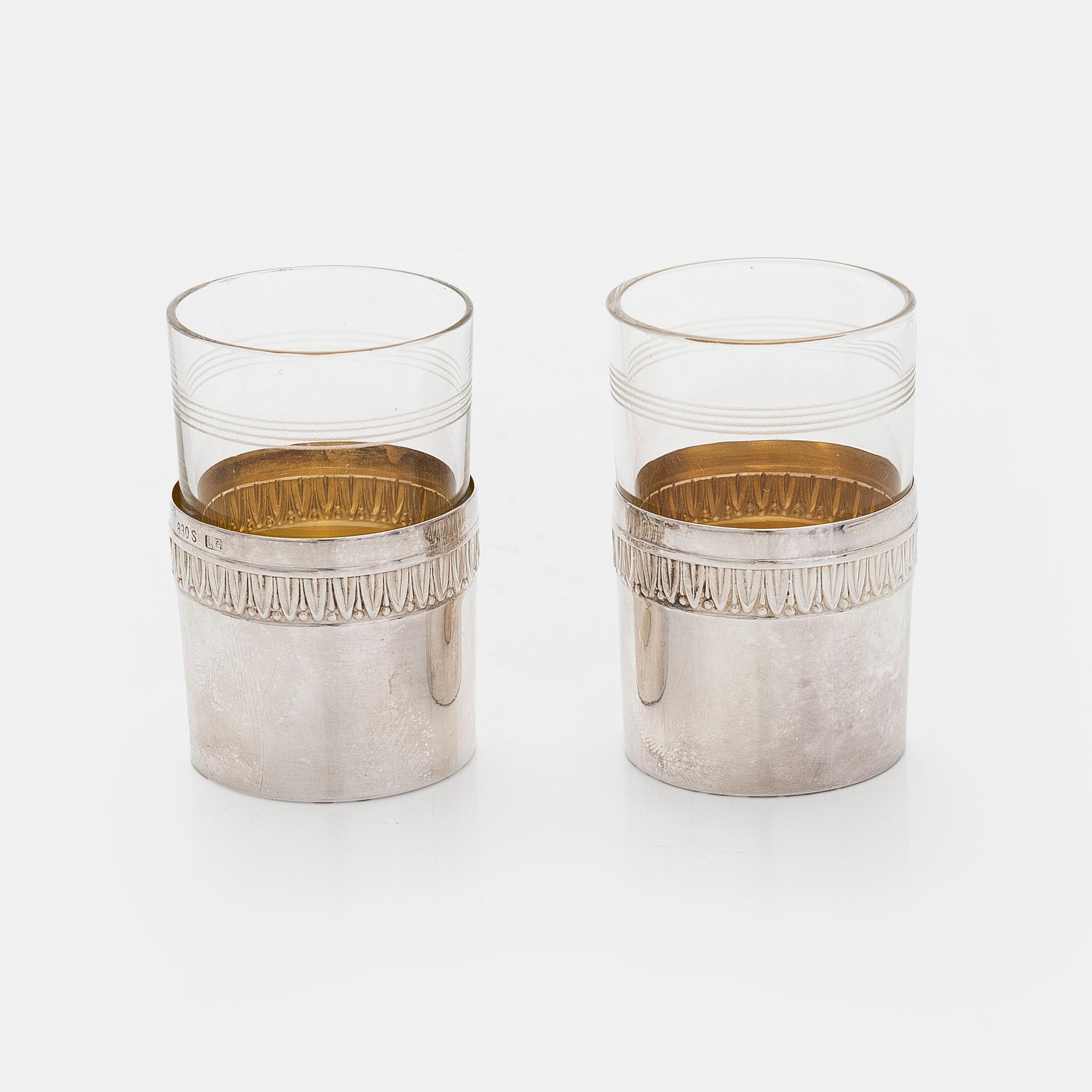 A set of six shot glasses with a tray in original fitted box, silver and glass, likely Norway 1910s.
