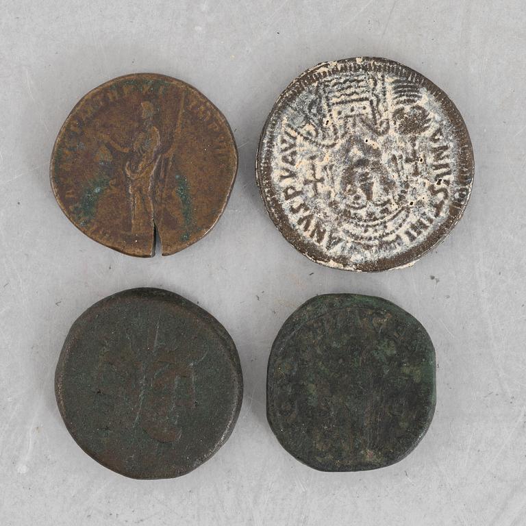 Four Roman coins.