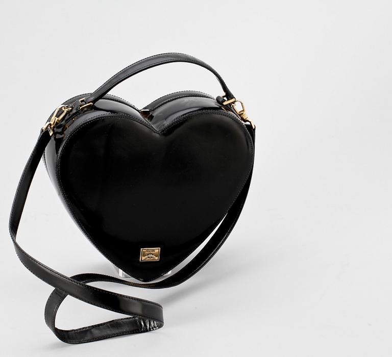 A black lacquer handbag by Moschino.