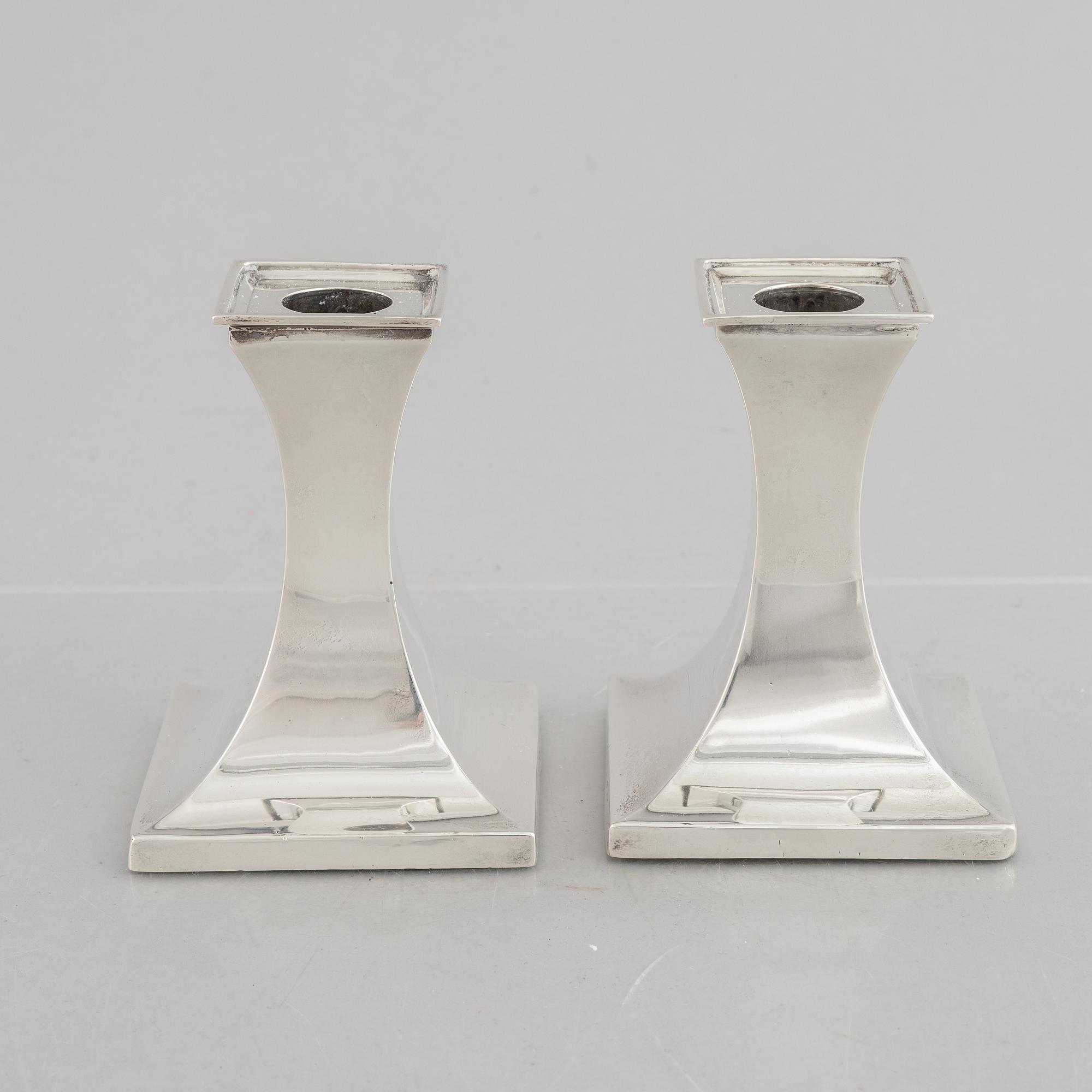 A pair of silver candlesticks, mark of William Hutton & Sons Ltd, Sheffield 1911-1912.