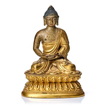 867. A gilt kopper alloy figure of buddha, Tibeto-Chinese, 18th Century.