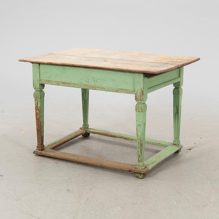 A painted wooden table from the first half fo the 20th century.