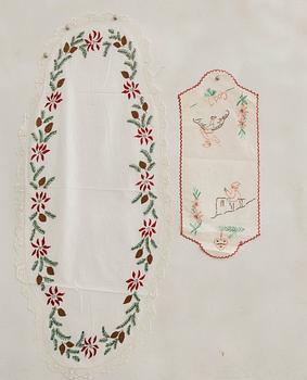 A collection of smaller Christmas tablecloths, runners, and wall hangings, approximately 34 pieces, mid/second half of the 20th century.
