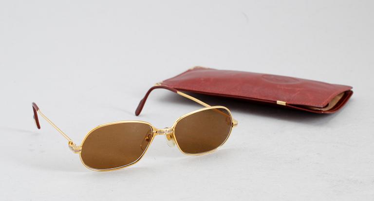 SOLGLASÖGON, Cartier.
