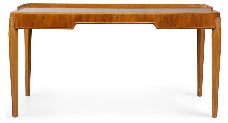 A Carl-Axel Acking mahogany and walnut desk, Sweden 1940's-50's.