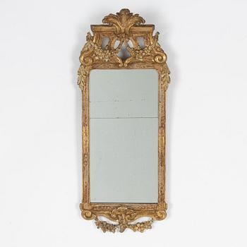 A Gustavian carved giltwood mirror, Stockholm, late 18th century.