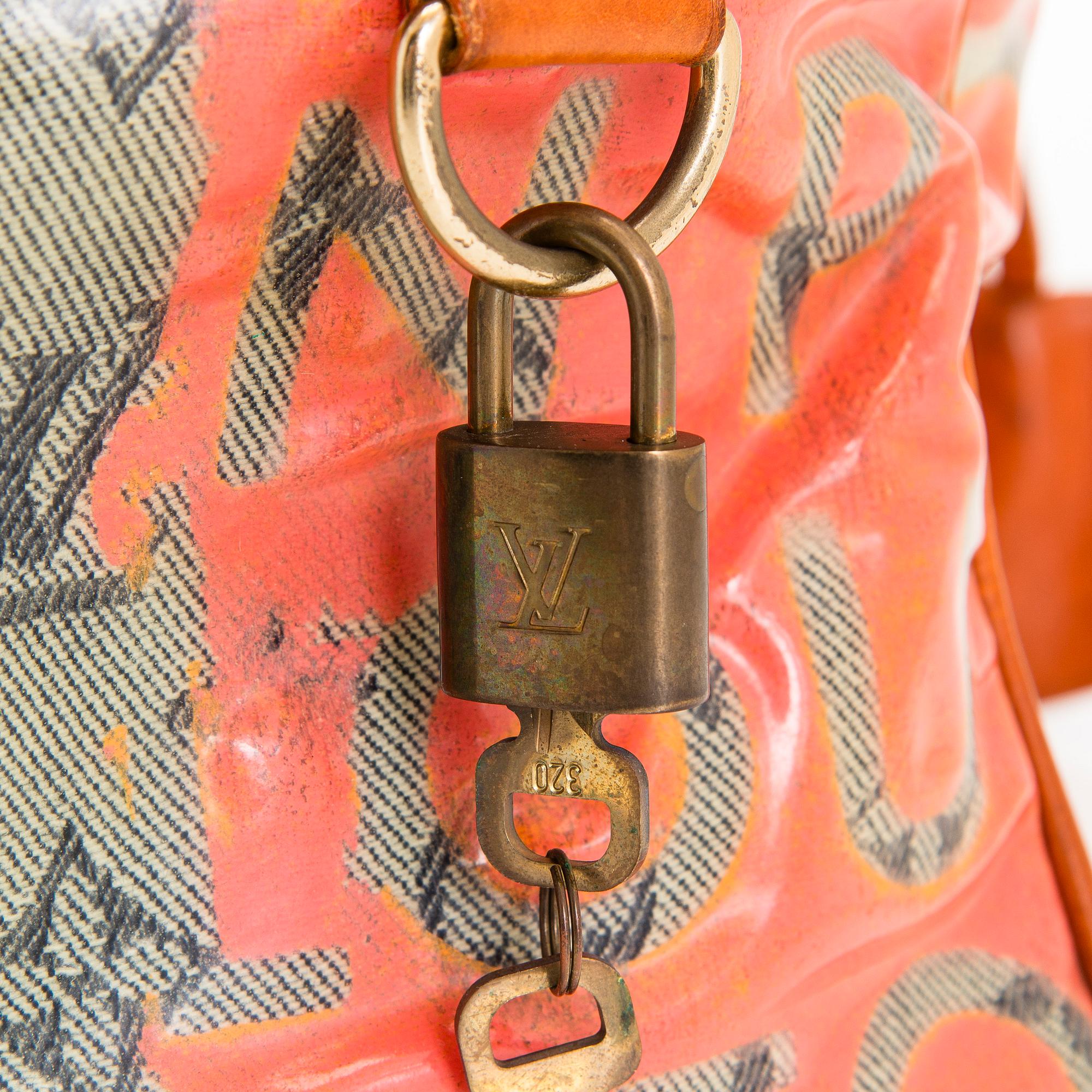 Louis Vuitton, a 'Le Rose Defile Denim Pulp PM' bag design Richard Prince.