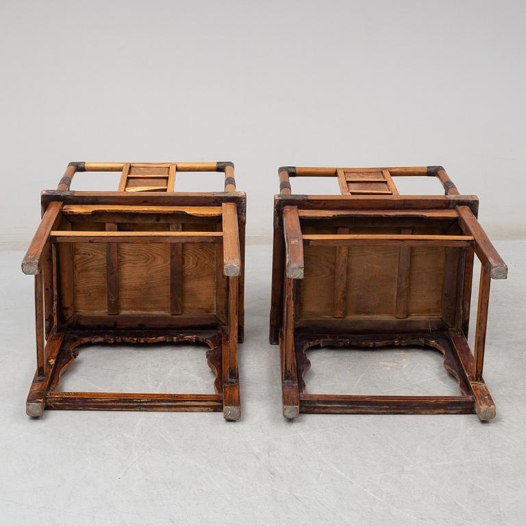 A pair of Chinese wooden armchairs, late 19th/early 20th century.