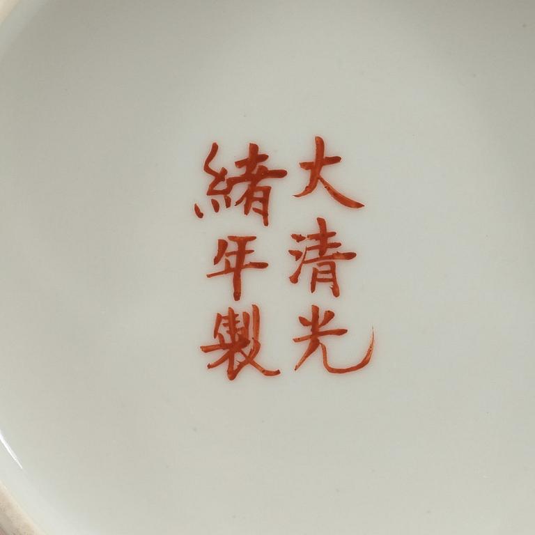A set of four yellow ground famille rose bowls with covers, early 20th century with Guangxu six character mark in red.