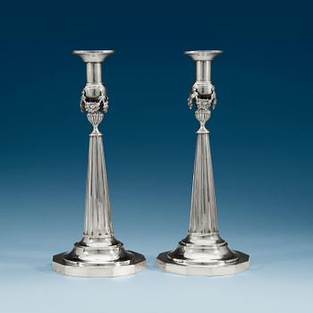 1010. A pair of German late 18th century silver candlesticks, makers mark possibly Johann Georg Fournier II, Berlin.