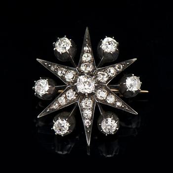 A BROOCH / PENDANT, old cut diamonds, 14K gold, silver.