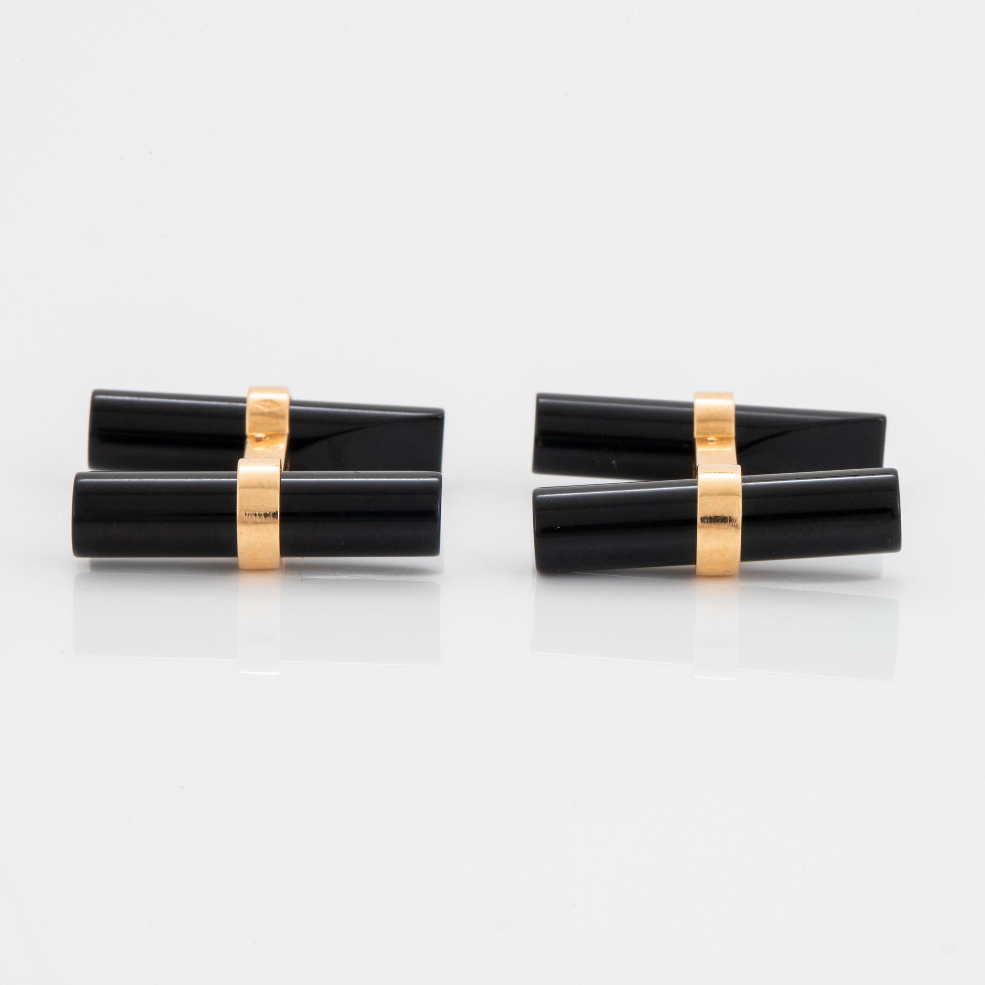 Cartier ett par manschettknappar 18K guld och onyx.