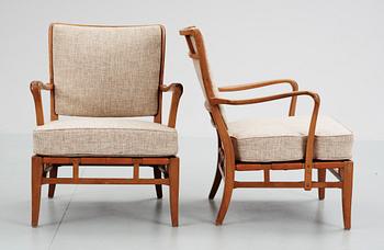 A pair of Carl-Axel Acking easy chairs by NK circa 1946.