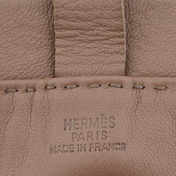 HERMÈS, a small veau swift etoupe shoulder bag.