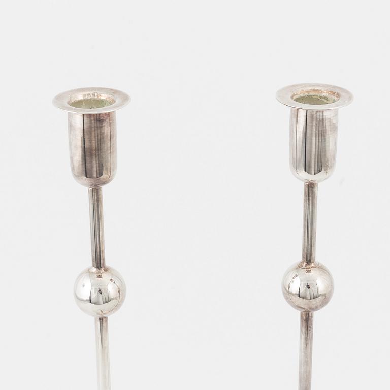 A pair of 'Kulan' candle sticks by Estrid Ericson for Firma Svenskt Tenn.