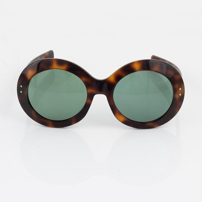 Oliver Goldsmith, a pair of tortoise "Koko" sunglasses.