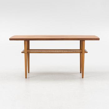 A 1960s teak coffee table.