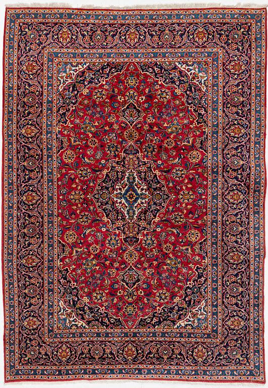 An oriental carpet, c. 340 x 240 cm.