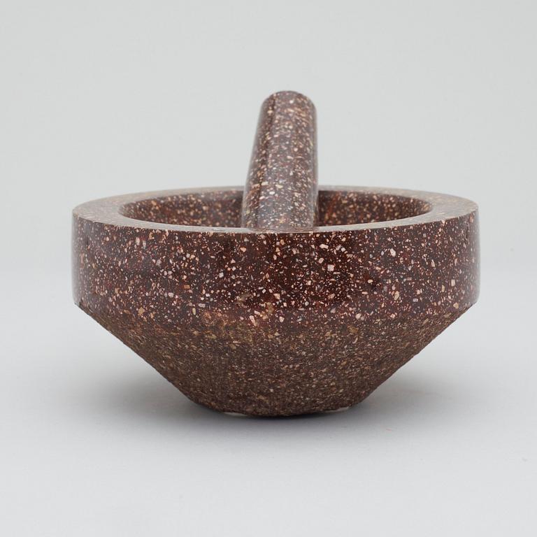 A Swedish porphyry mortar with pestel.