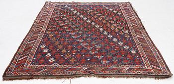 An antique Qashgai rug, 230 x 135 cm.