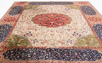 A semi-antique pictoral carpet from Northern india, ca 396 x 293 cm.
