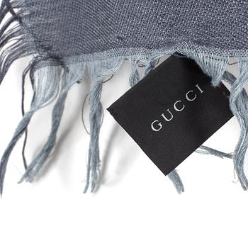 A shawl by Gucci.