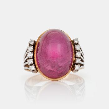 584. A cabochon-cut tourmaline and brilliant-cut diamond ring.