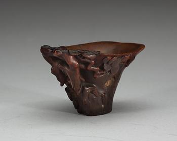 A carved rhinoceros libation cup, Qing dynasty, 18th Century.