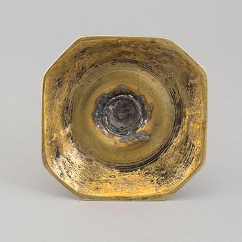 An 18th century bronze candlestick.