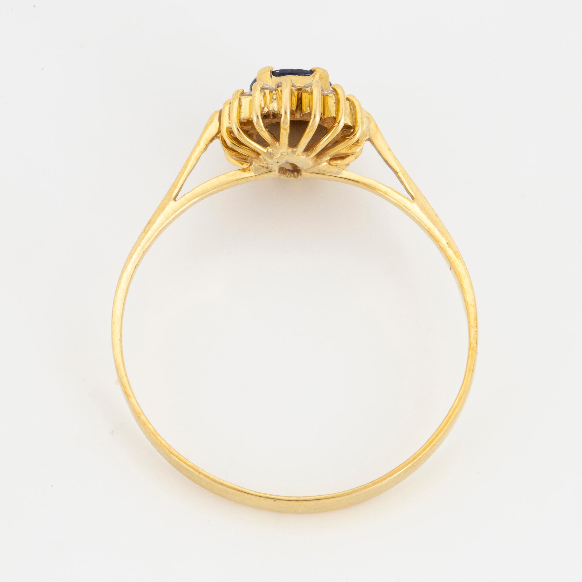 Oval mixed-cut sapphire and round brilliant-cut diamond halo ring.